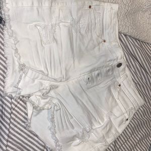 White denim button fly mid length shorts
